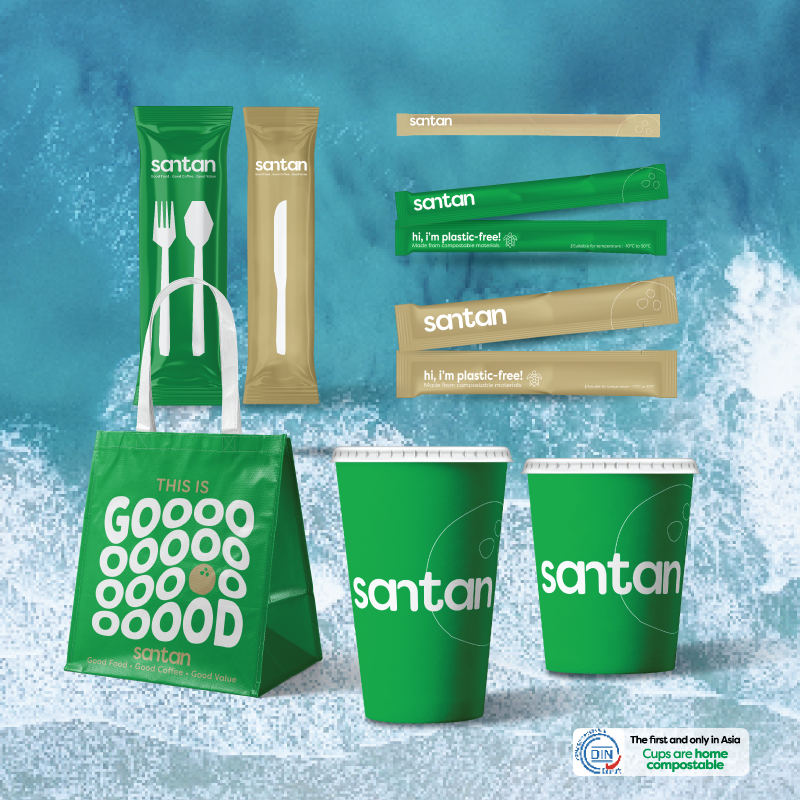 Set of eco-friendly disposable tableware including paper straws, paper knives, a paper bag, and paper cups, all branded with 'Santan' and promoting plastic-free packaging against a blue water background.