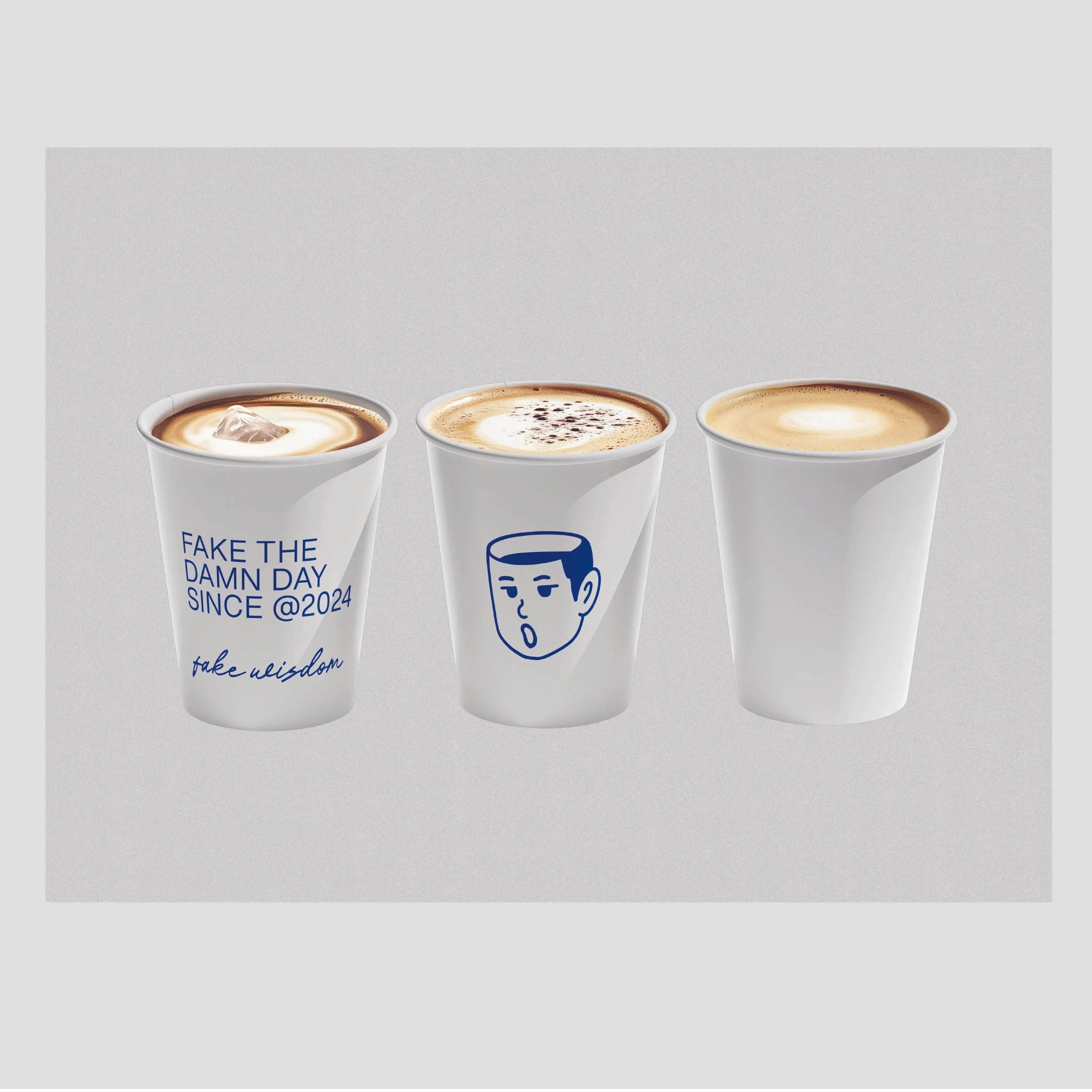 Three white coffee cups with different illustrations and messages, filled with coffee, against a light gray background.