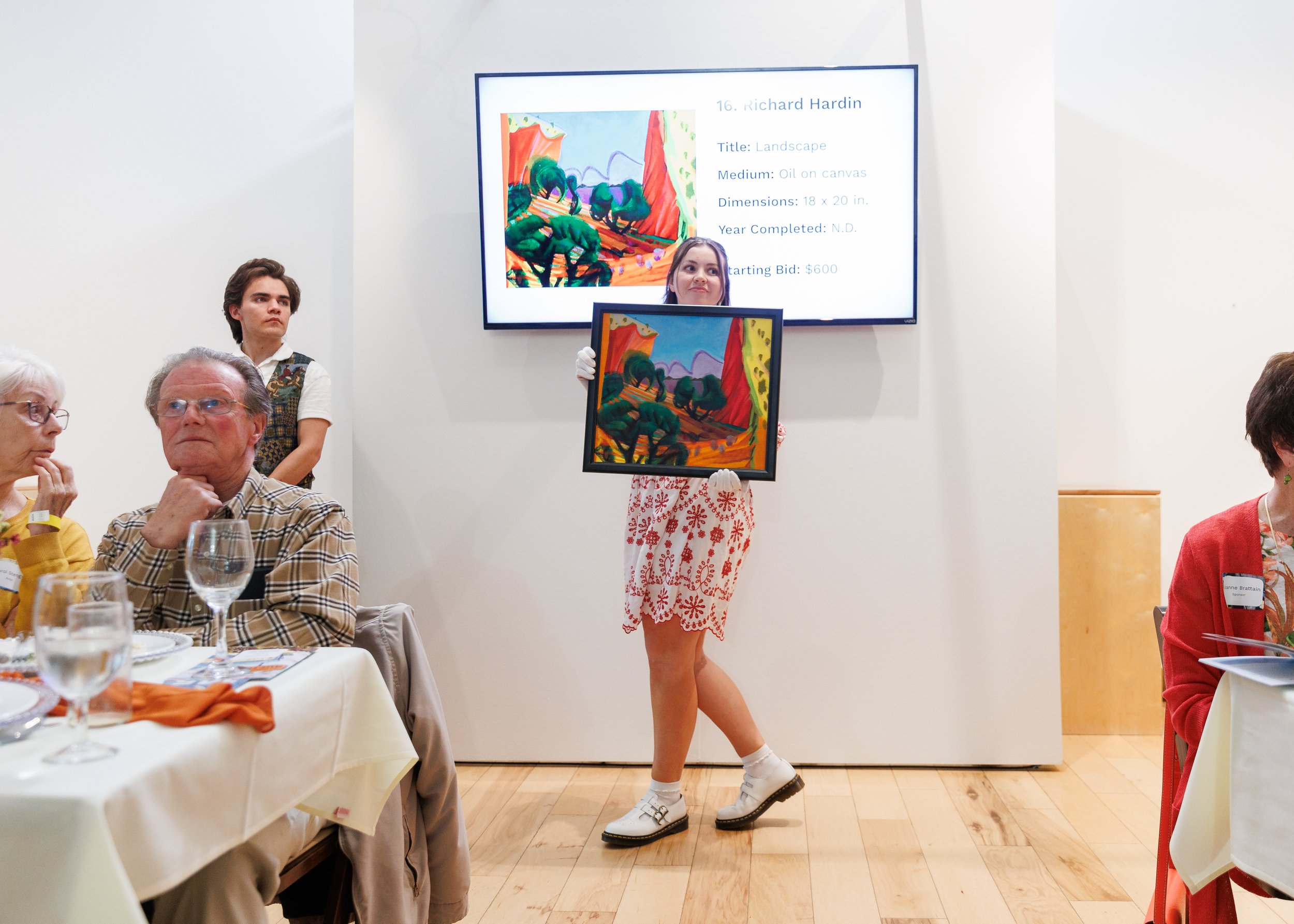 Amanda Lowry Wiberg displaying art in an art auction
