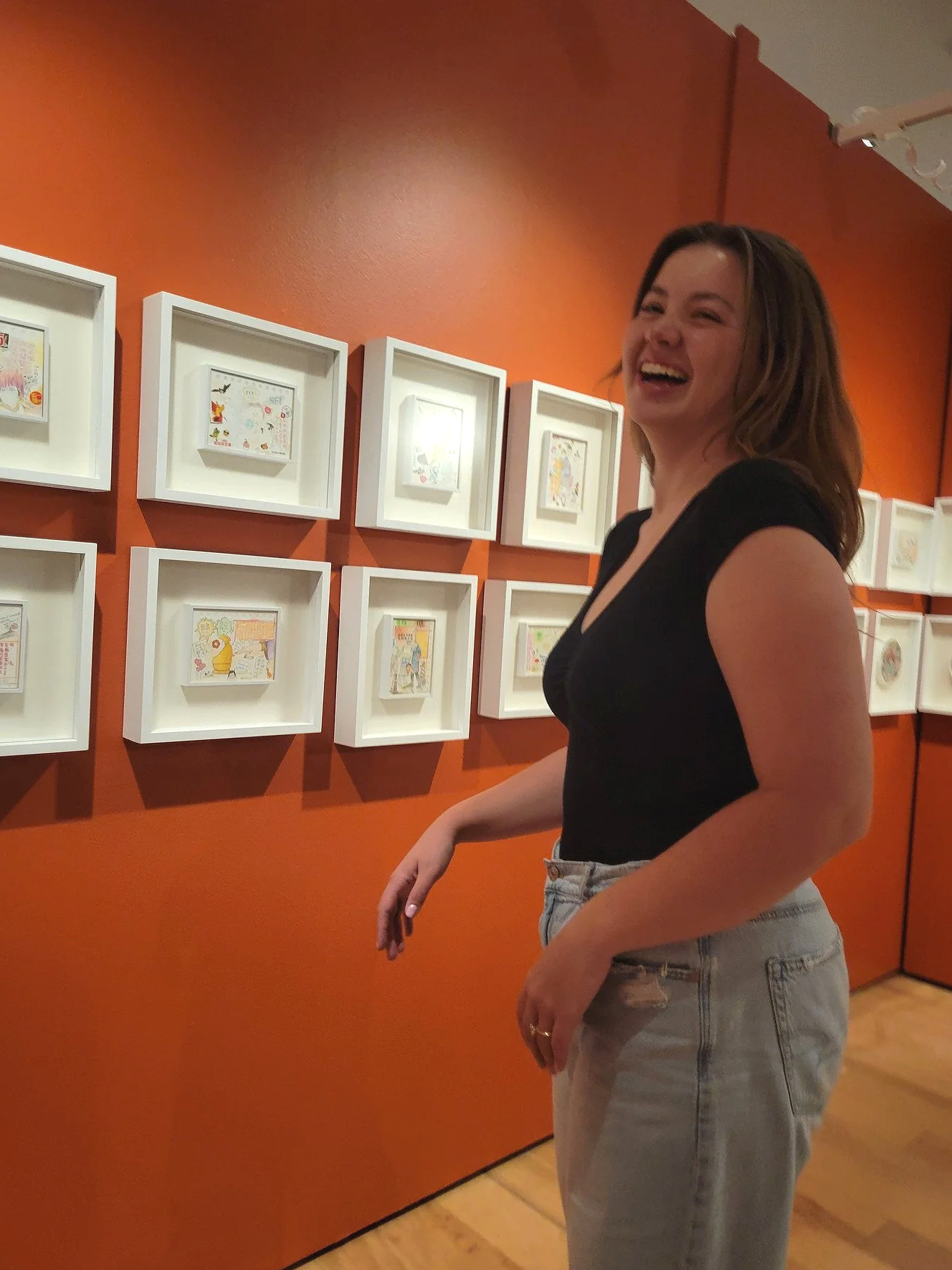 Amanda Lowry Wiberg laughing in an art gallery