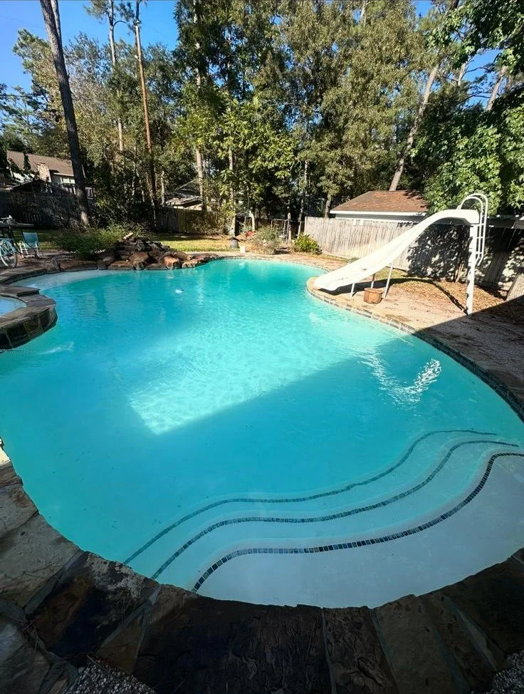 Clean residential swimming pool after weekly maintenance by WA The Pool Doctor in Spring, TX.