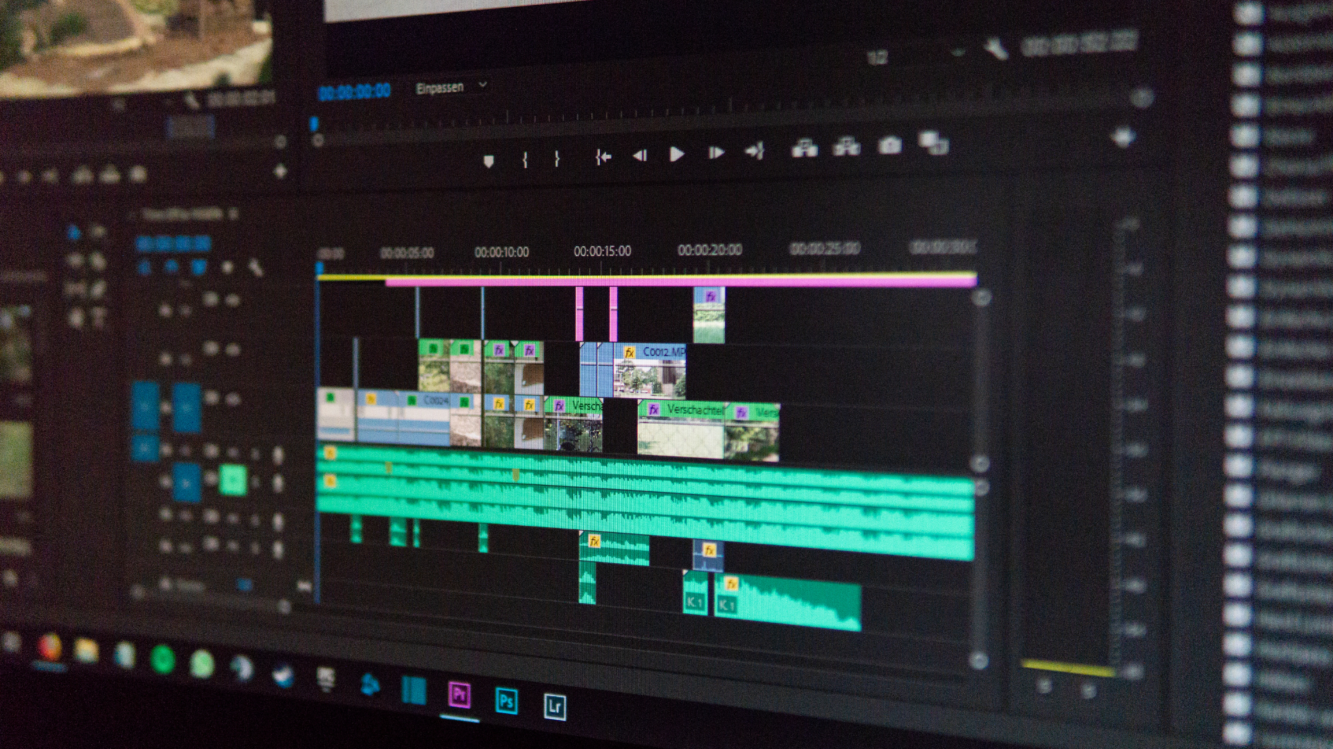 Computer screen displaying a video editing software timeline with multiple video and audio clips arranged in tracks.