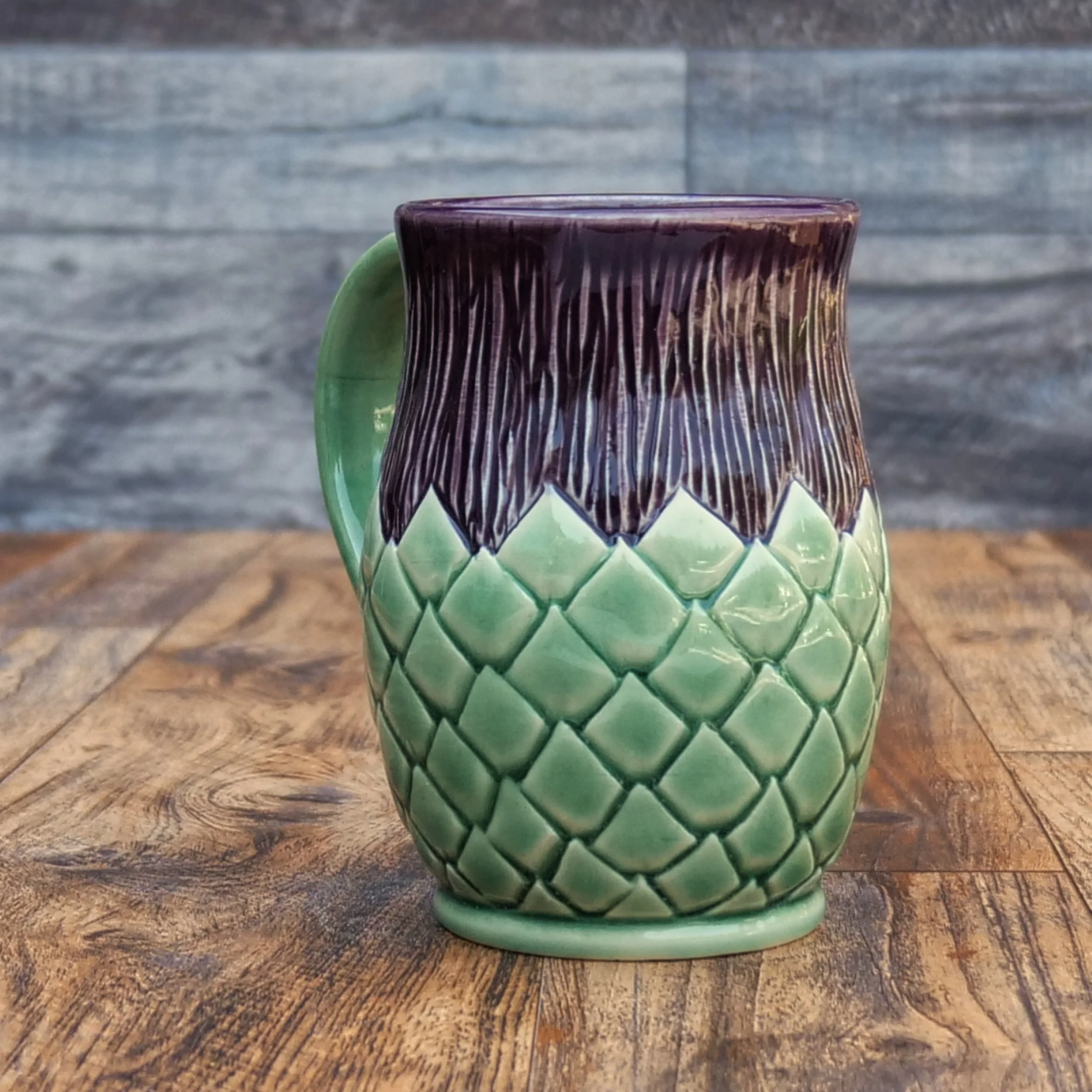 Handmade Highland Thistle Mug by Elderkiln Ceramics featuring sculpted thistle-inspired textures and layered purple and green stoneware glazes.