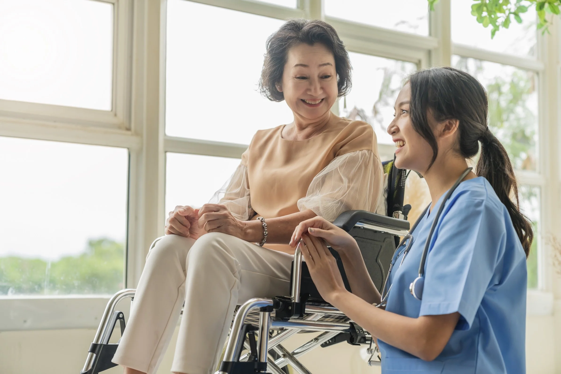 a caregiver caring for an elderly patient