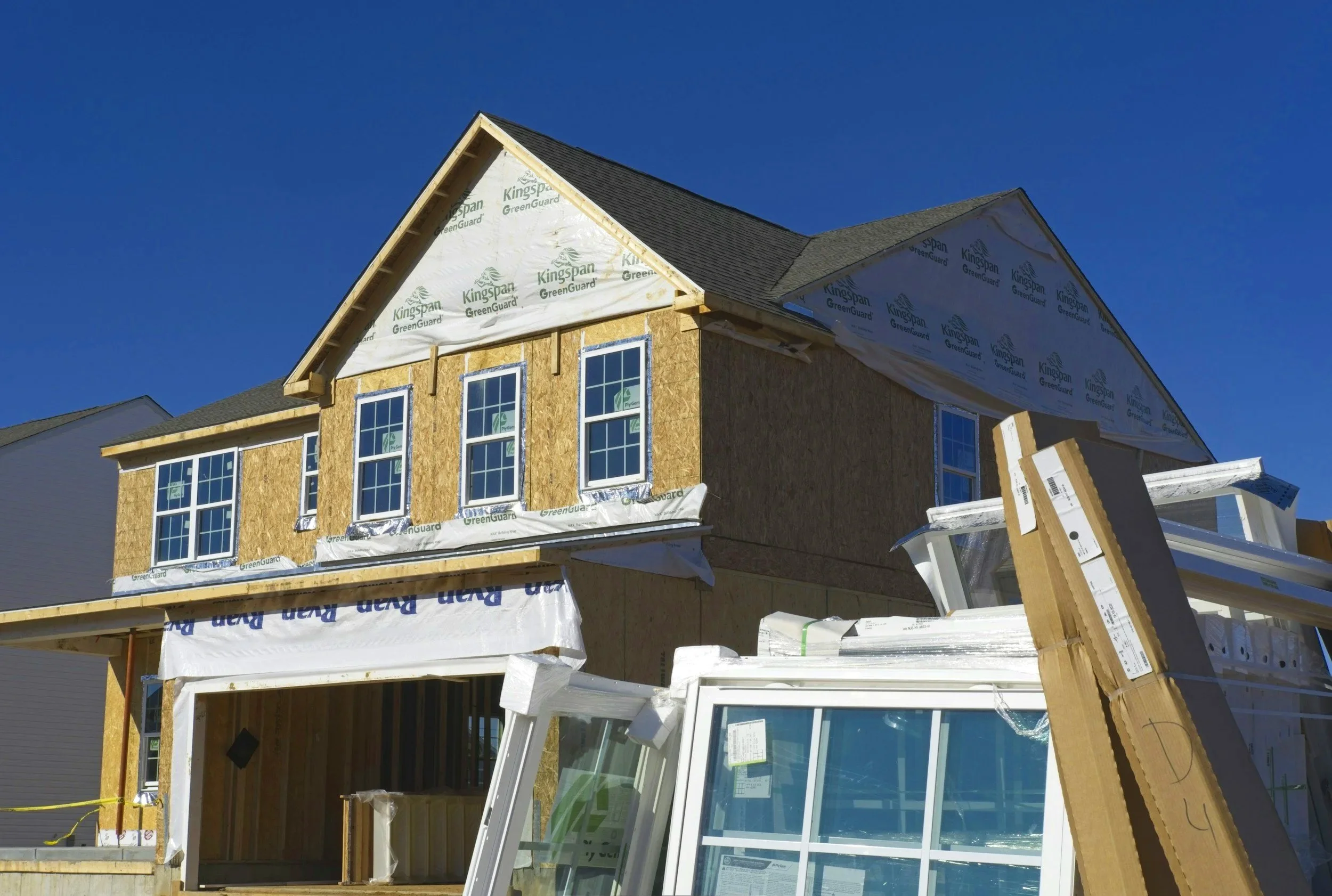 An exterior of a two-story home that is under construction.