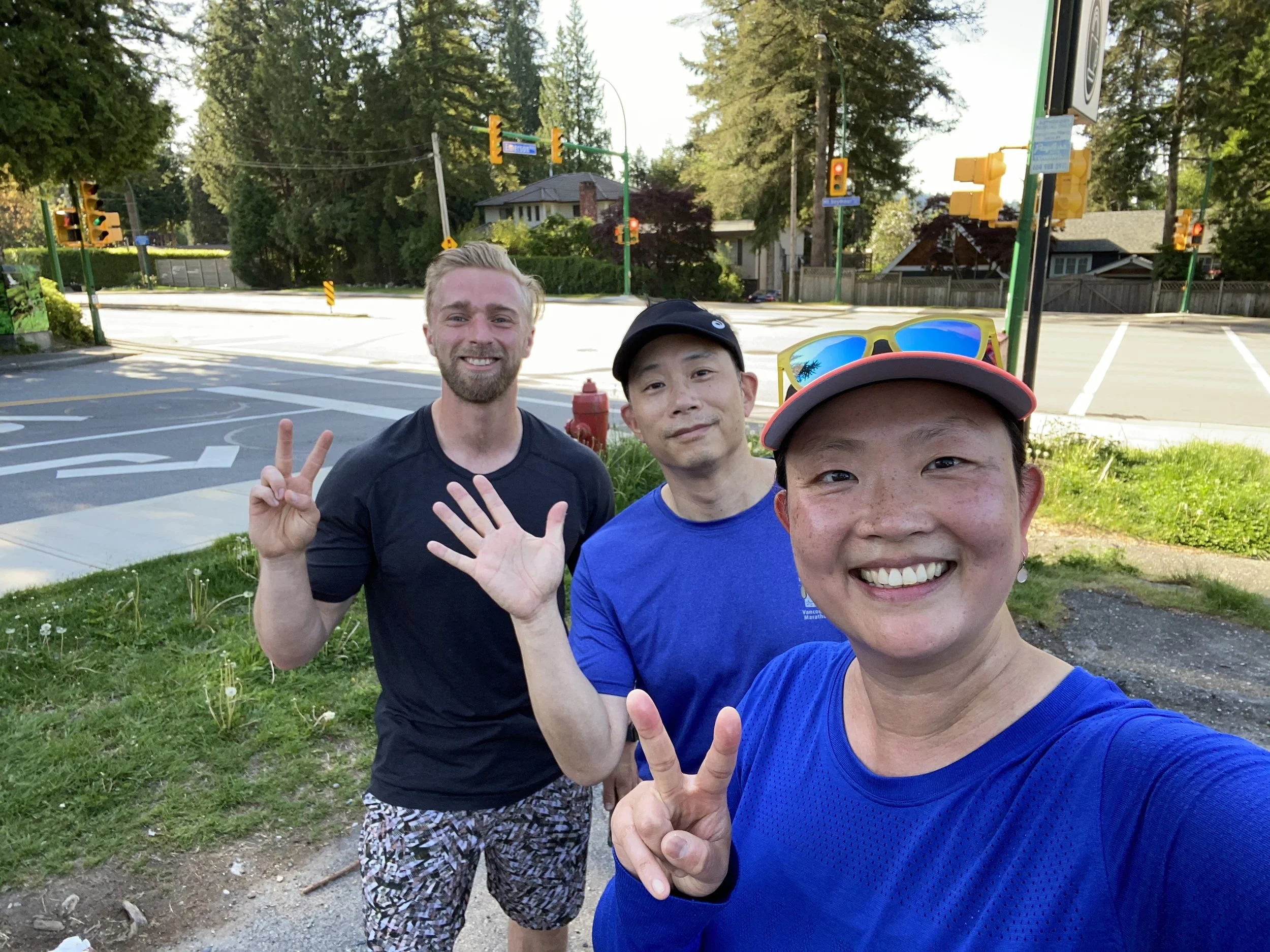 Personal trainer and two clients taking a selfie after a run in Vancouver
