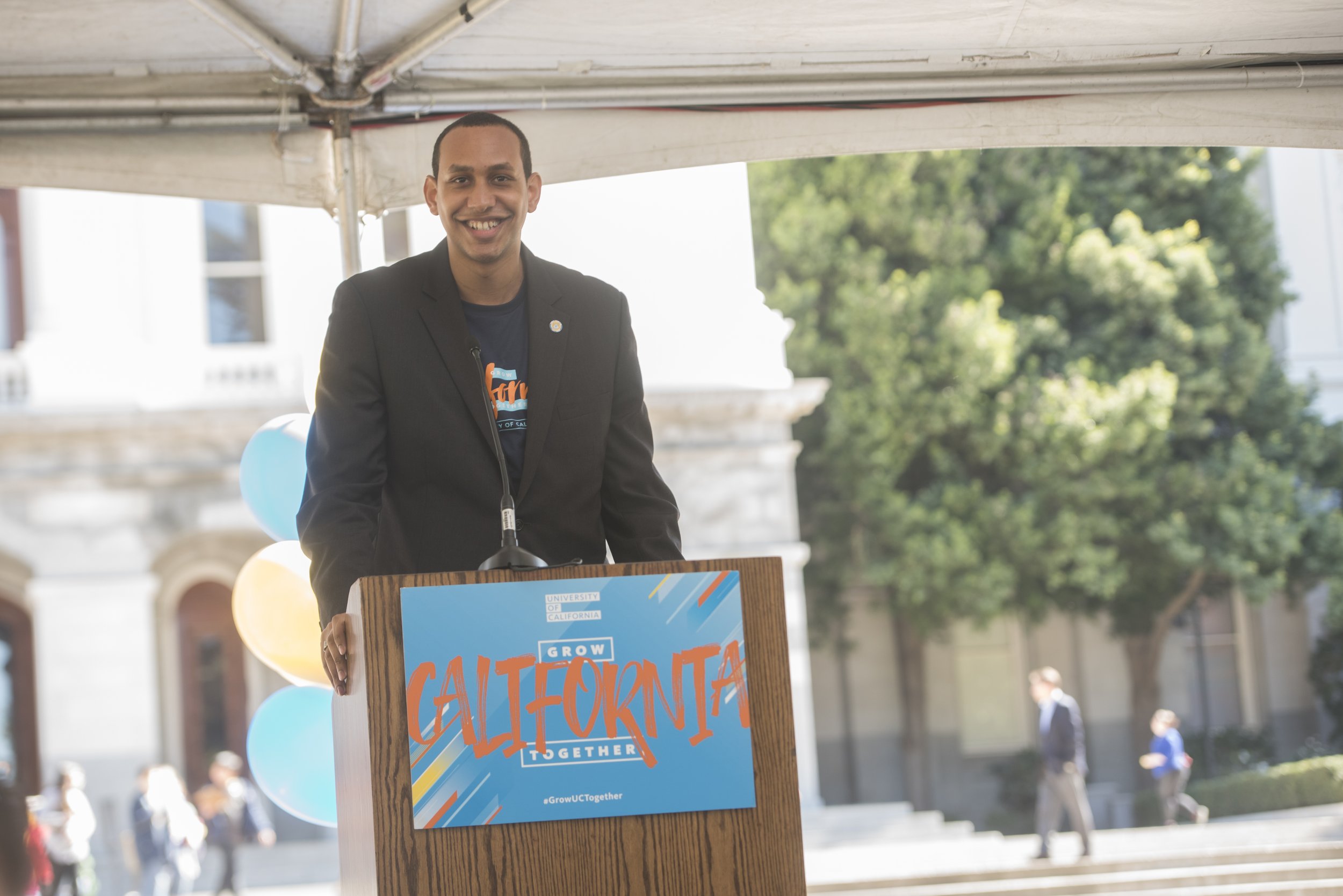 Devon standing at a podium.
