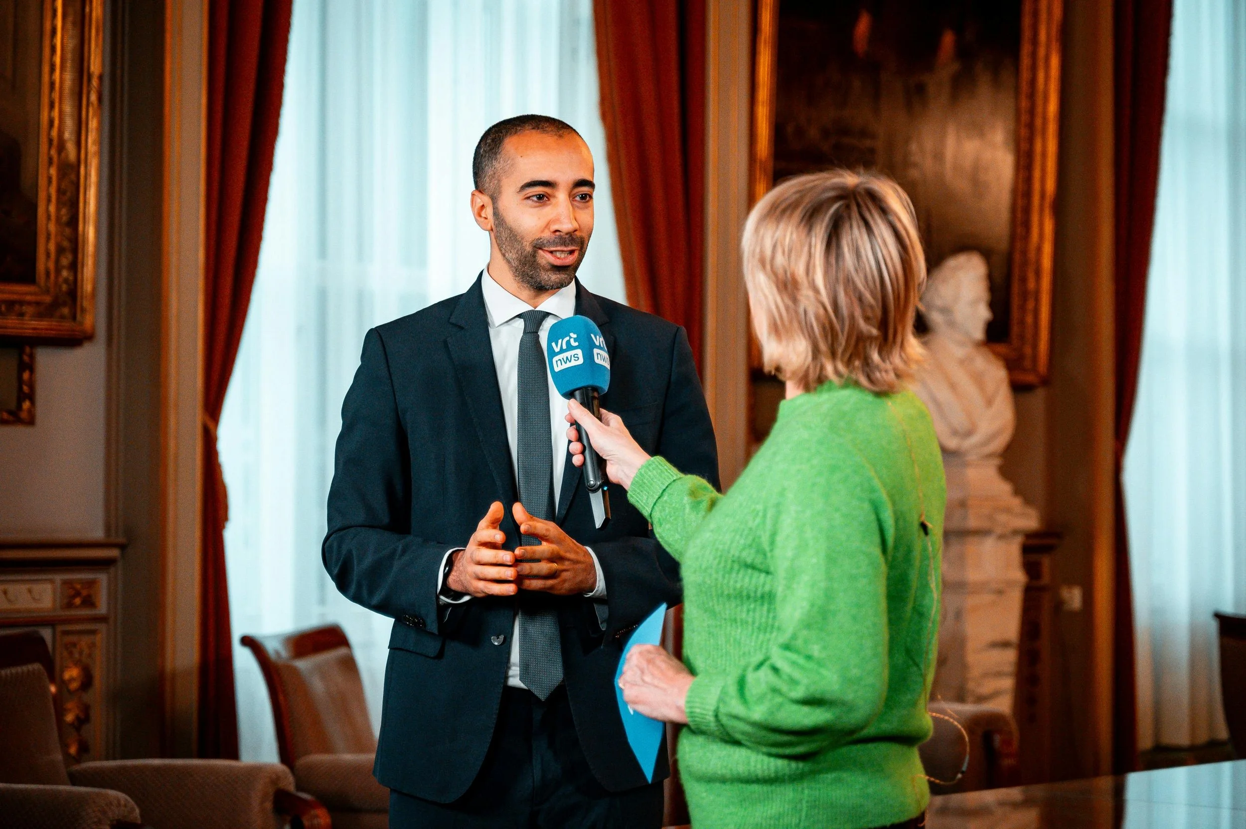 TV reporter interviewing a business executive — Paws PR broadcast media training for pet brand leaders