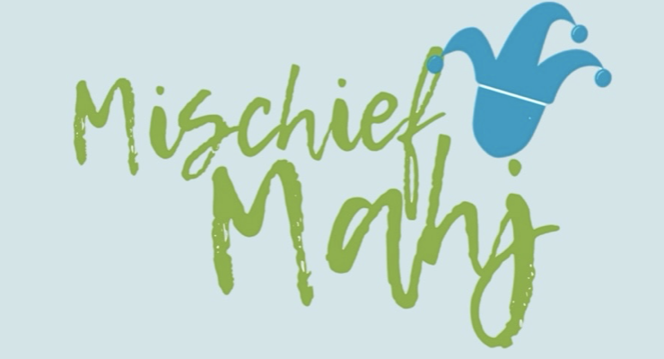 Logo with the text 'Mischief May' in green and a blue jester hat above the letter 'h'.