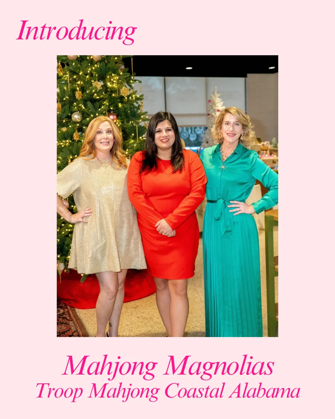 Three women standing in front of a Christmas tree with decorations, smiling at the camera, celebrating the holiday season, with text overlay introducing Mahjong Magnolias Troop Mahjong Coastal Alabama.