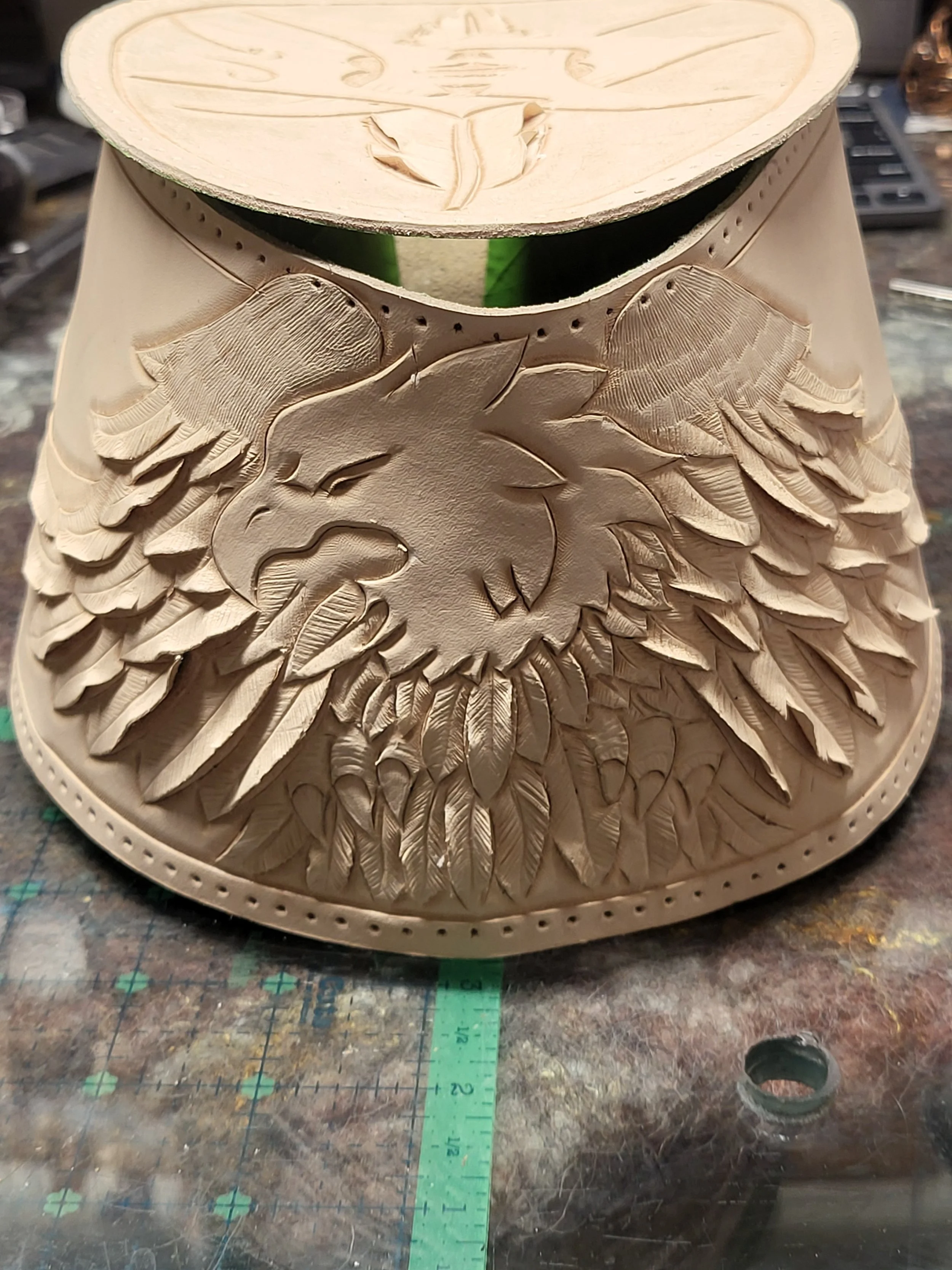 Wooden lamp with carved eagle design on the front.