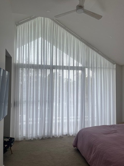 Sheer Knife Pleat Curtains on raked ceiling