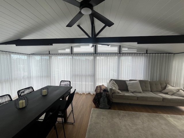 Sheer Curtains with Plantation Shutters above