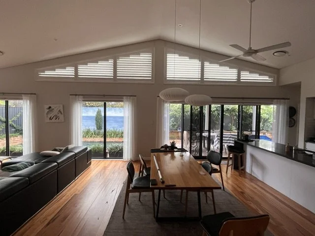 Basswood Timber Superspan plantation shutters installed on shaped windows in Oran Park