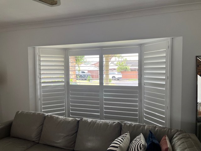 Plantation Shutter in Bay Window in Snow White colour and with wider 114mm louvres