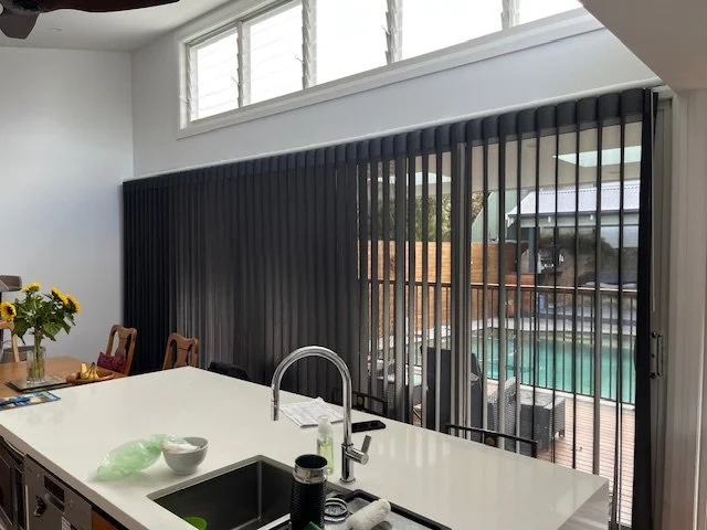 Black Verishade Blind over sliding door. Great for large areas