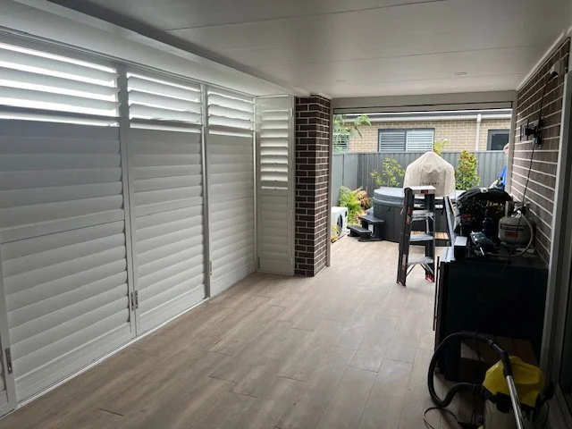 Sliding and Hinged Outdoor Shutters in Surf Mist Colour at Elderslie (After Photo) & with motorised Zipscreen Awning
