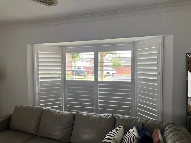 Basswood Shutters with the wider 114mm louvre with bay window posts