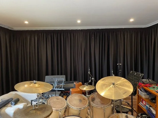 Knife Pleat Curtains with Heavy 2.8 Fullness in Tripleweave Acoustic fabric to help keep the sound inside only