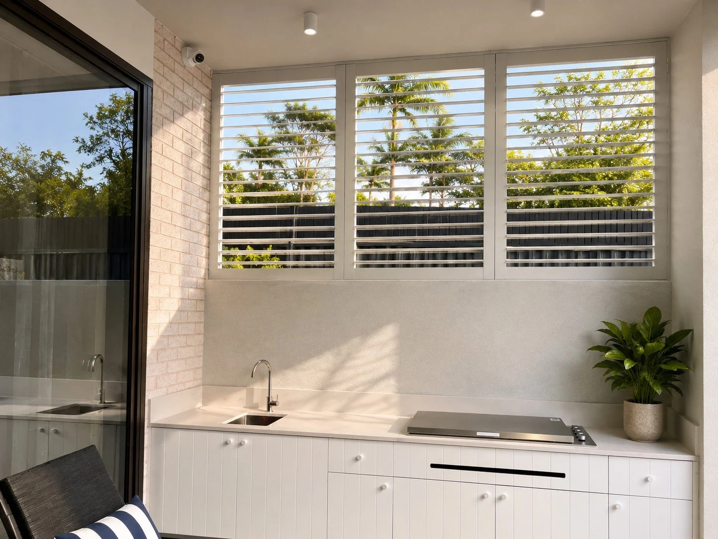 AI preview of Slimline Series outdoor shutters for an outdoor kitchen area in Wilton NSW showing privacy, airflow and weather protection.