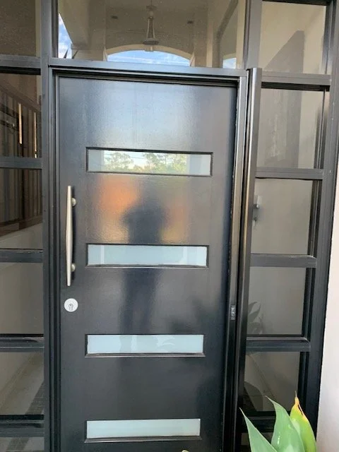 Custom retractable fly screen installation in Camden South shown in open position on a modern front entry