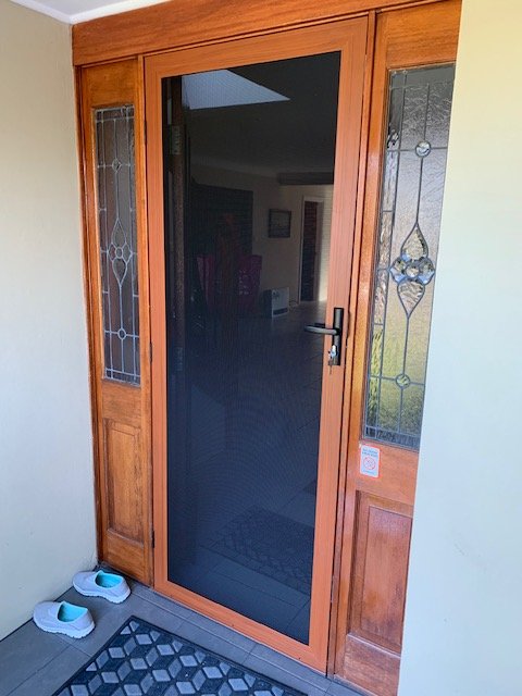 Hinged Supasceen Security Door in Western Red Cedar Woodgrain Colour