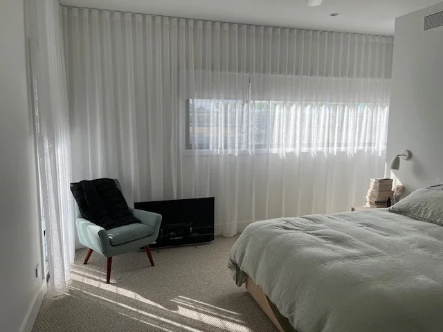 Butting Roller Blinds behind Sheer S-Wave Curtain