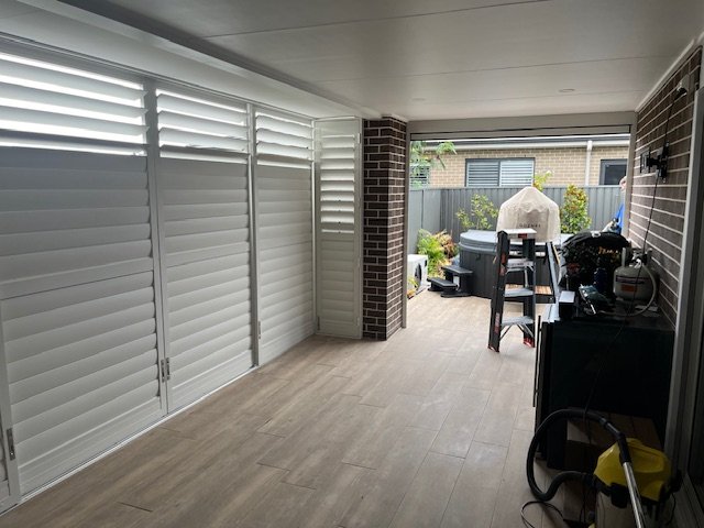 Outdoor aluminium shutters installed alongside a motorised Zipscreen awning in an Elderslie entertaining area.