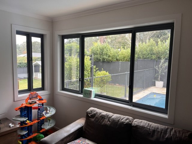 Living room in a Camden home before roller blinds installation