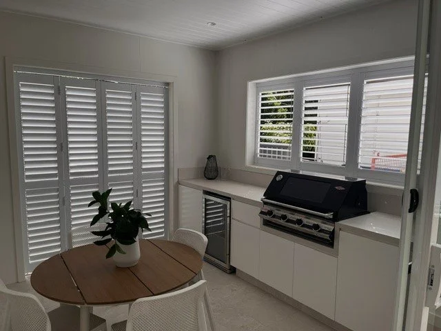 Indoor view of outdoor shutters closed in a Picton entertaining area