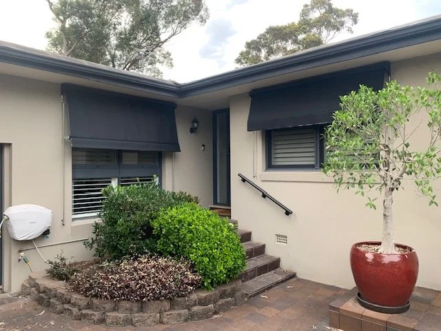 Automatic Awnings in Black Acrylic Fabric