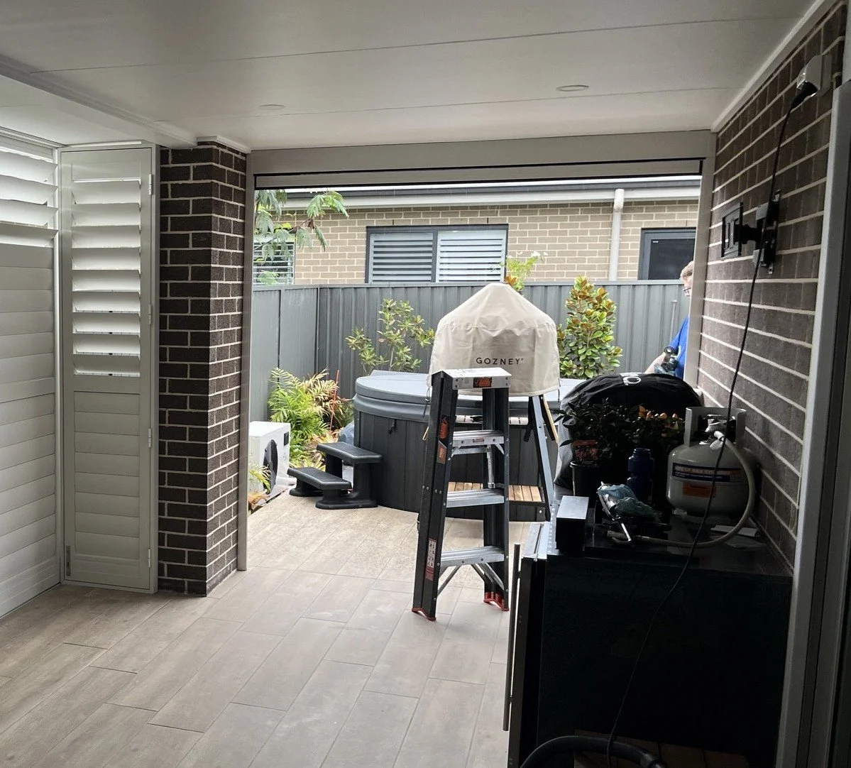 Zipscreen Awning with Outdoor Shutters to seal up the alfresco area while still allowing easy access.