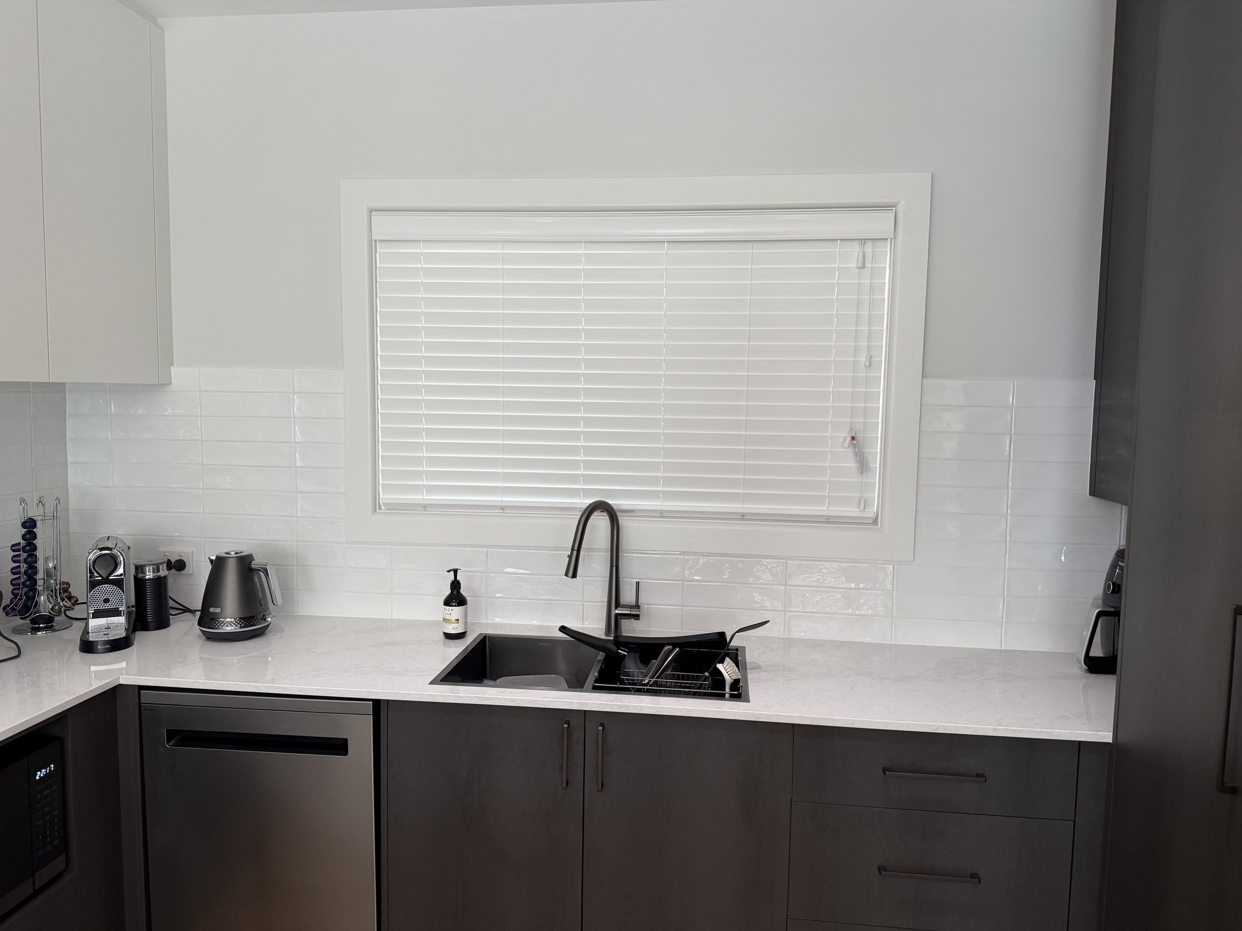 50mm PVC Venetian offering great light control & privacy on this Menangle kitchen.