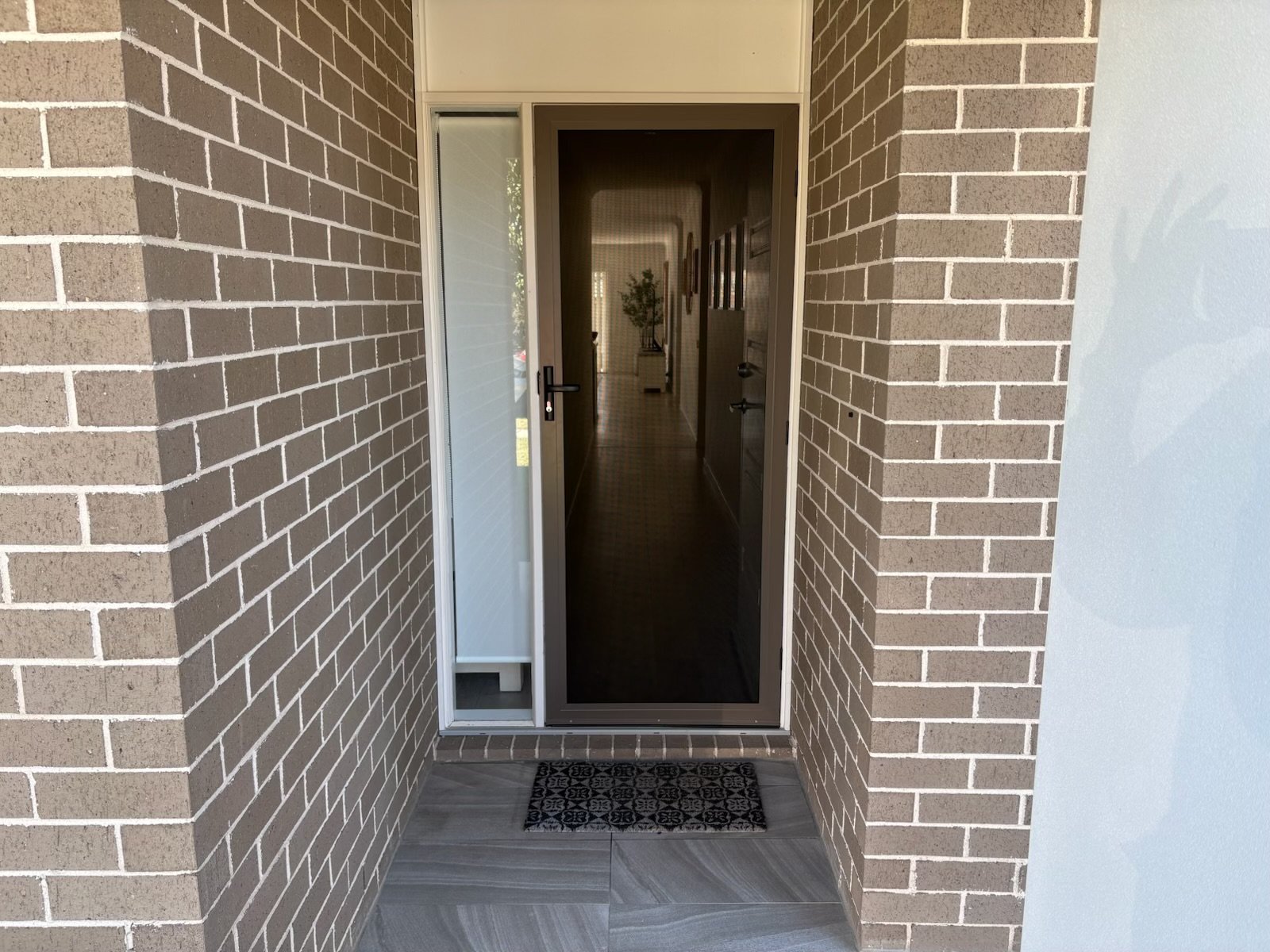 Supascreen Security Door in Jasper colour with Roller Blind on sidelight window