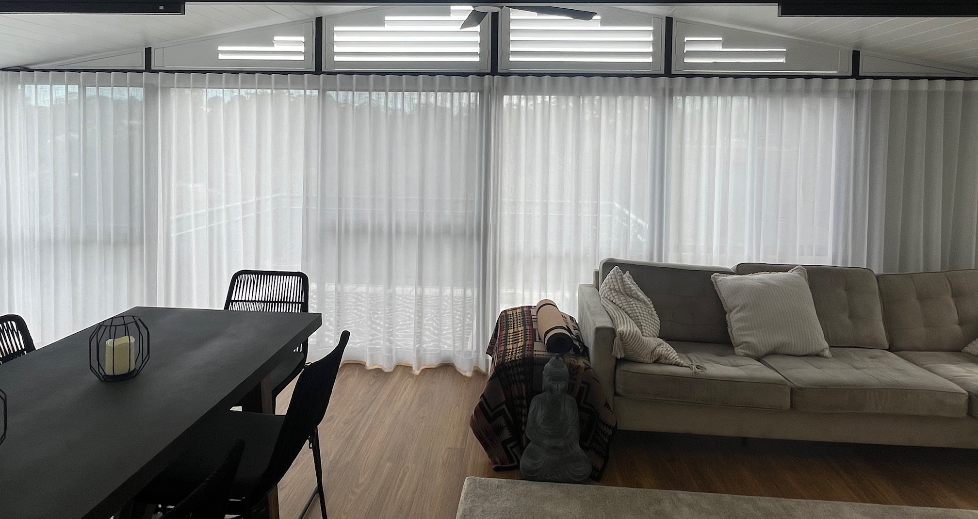 Raked Shutters with Sheer Curtains