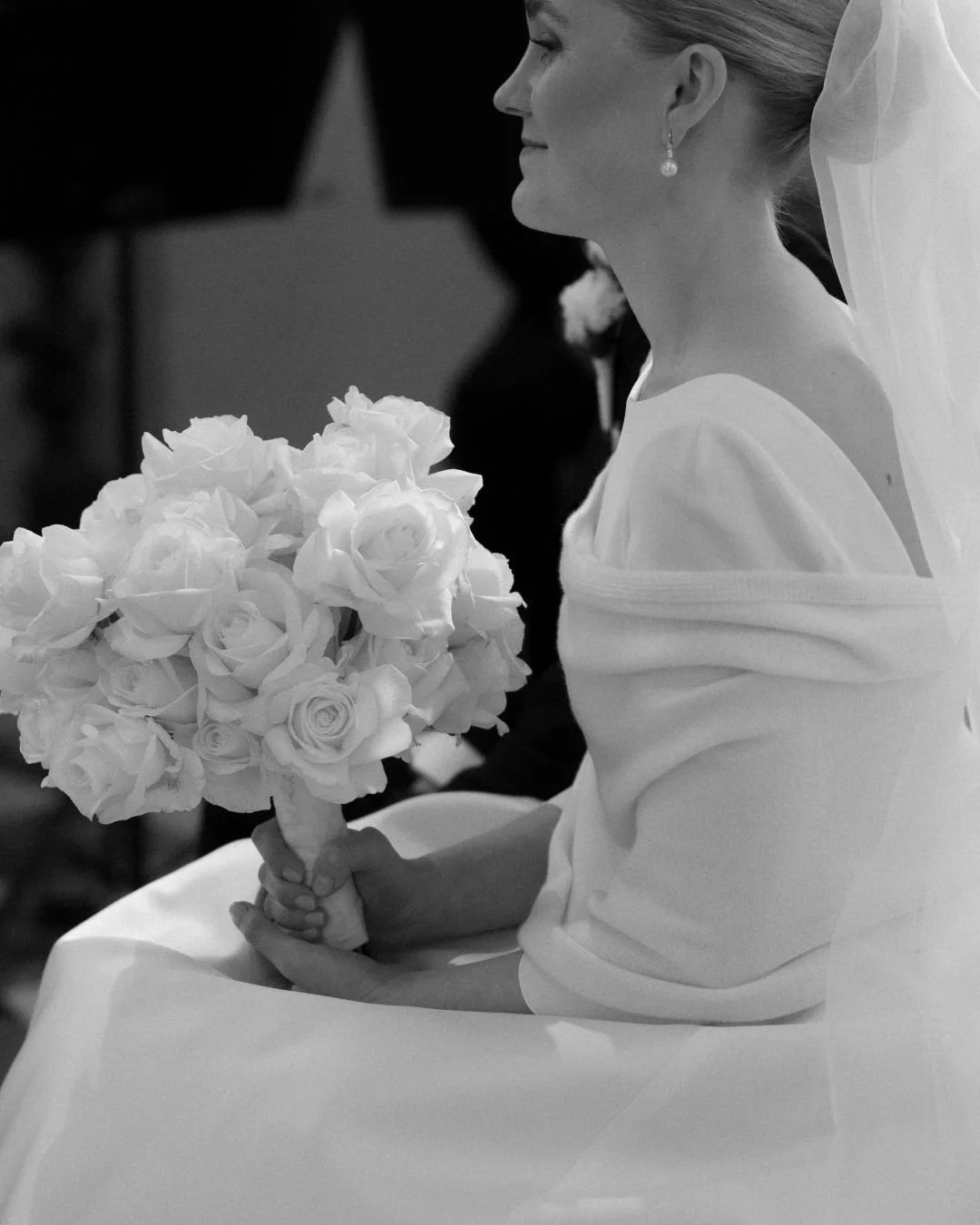 Happy bride holding bouquet at destination wedding in Italy
