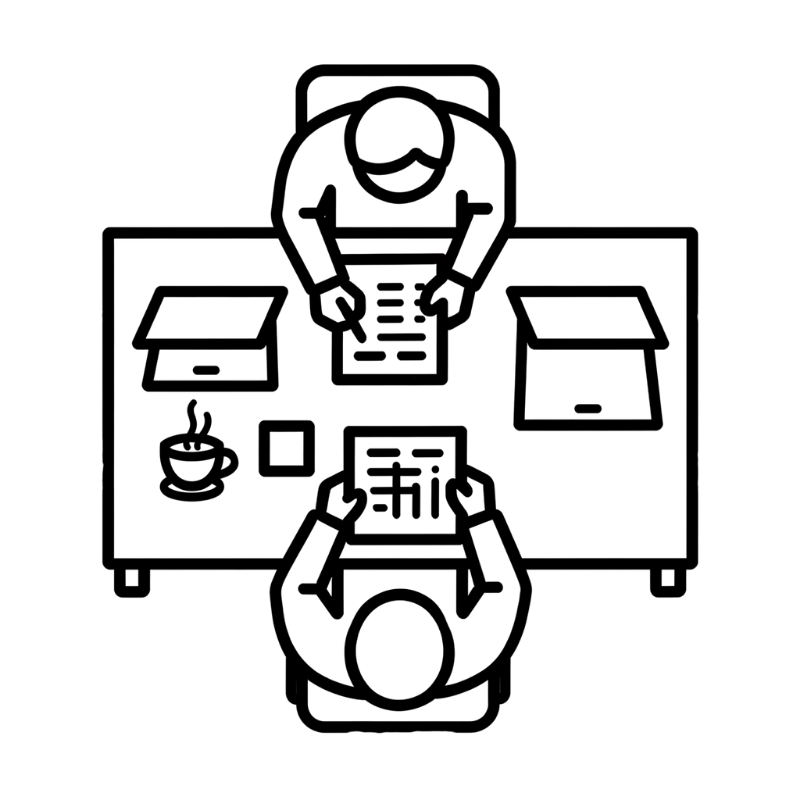 A line drawing of a person sitting at a desk, reaching across it, with a robot standing in front, holding a box. The desk has an open laptop, a flower in a pot, and a framed picture.