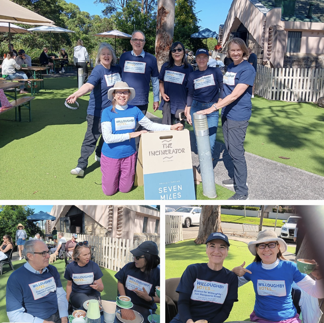 Group of six people at an outdoor event, all wearing blue 'Willoughby Votes' shirts, smiling, with a small table of food and drinks, and other people sitting and standing in the background.