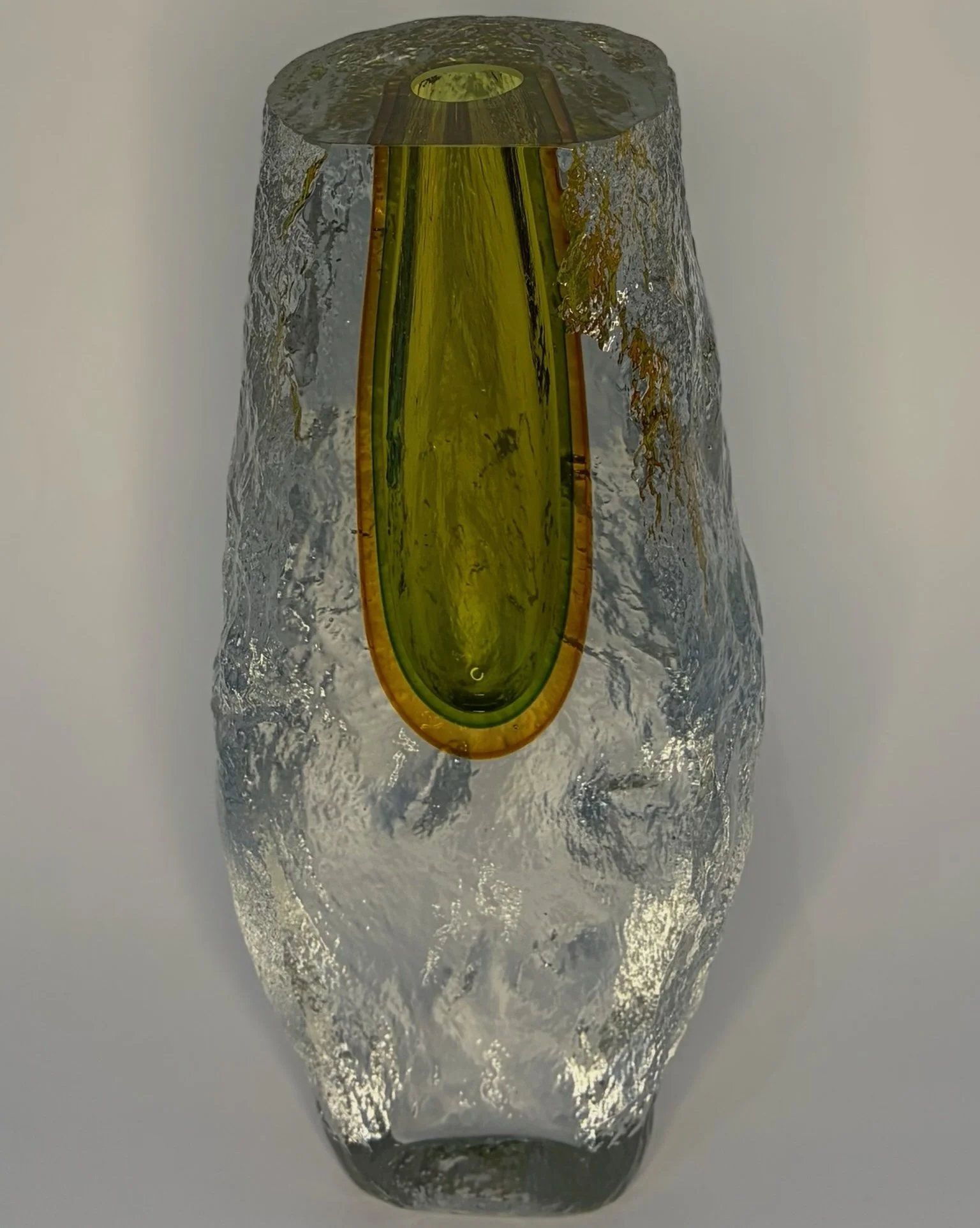 058-narrower clear vase with green hole.jpeg