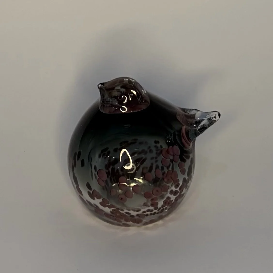 063-black round bird with brown spots.jpeg