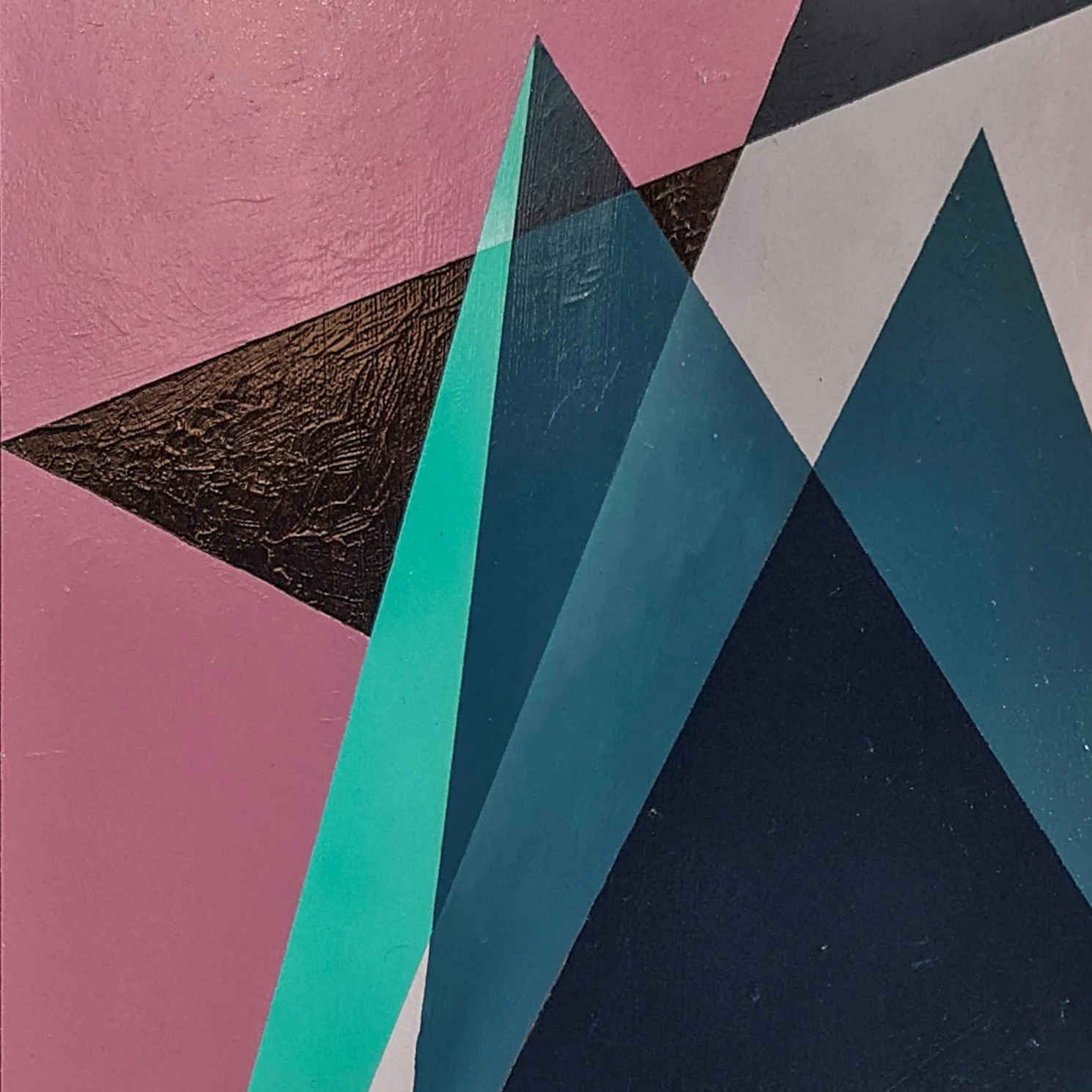 Close-up of an abstract geometric painting with pink, teal, black, and gray triangular shapes.