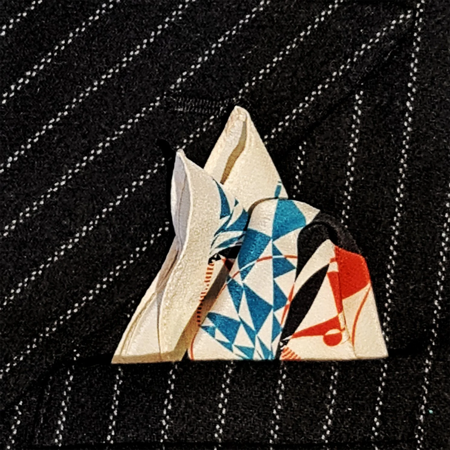 silk pocket square on a pinstripe jacket.