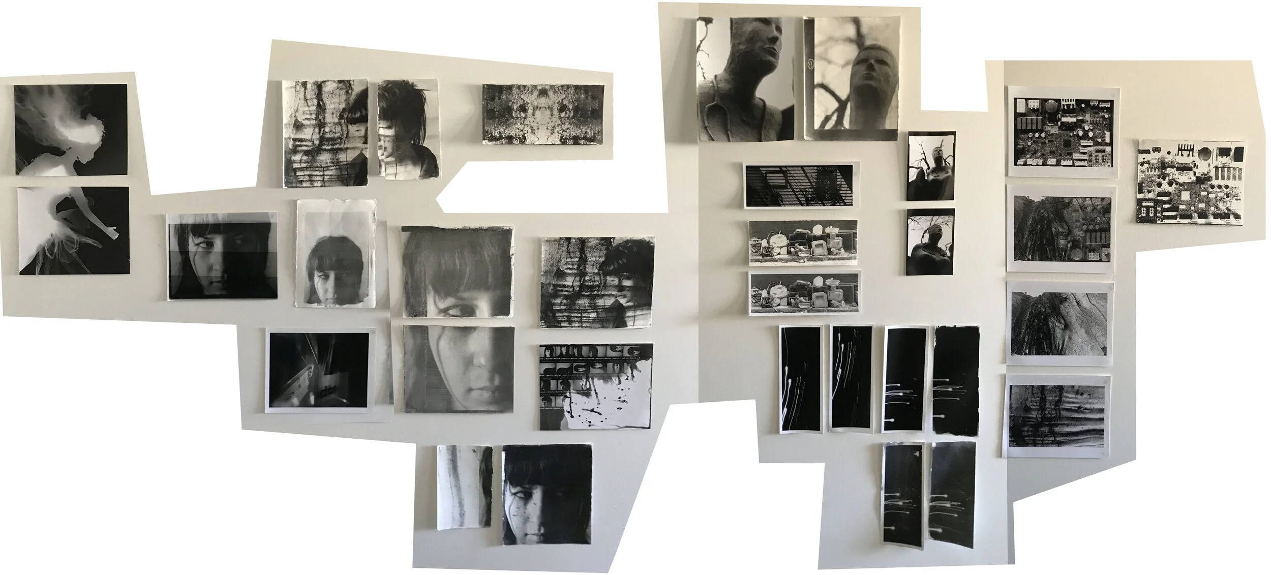 Walls and cupboard doors covered with test prints of current works in progress including liquid light on rag, silver gelatin MGIV and giclée test prints.