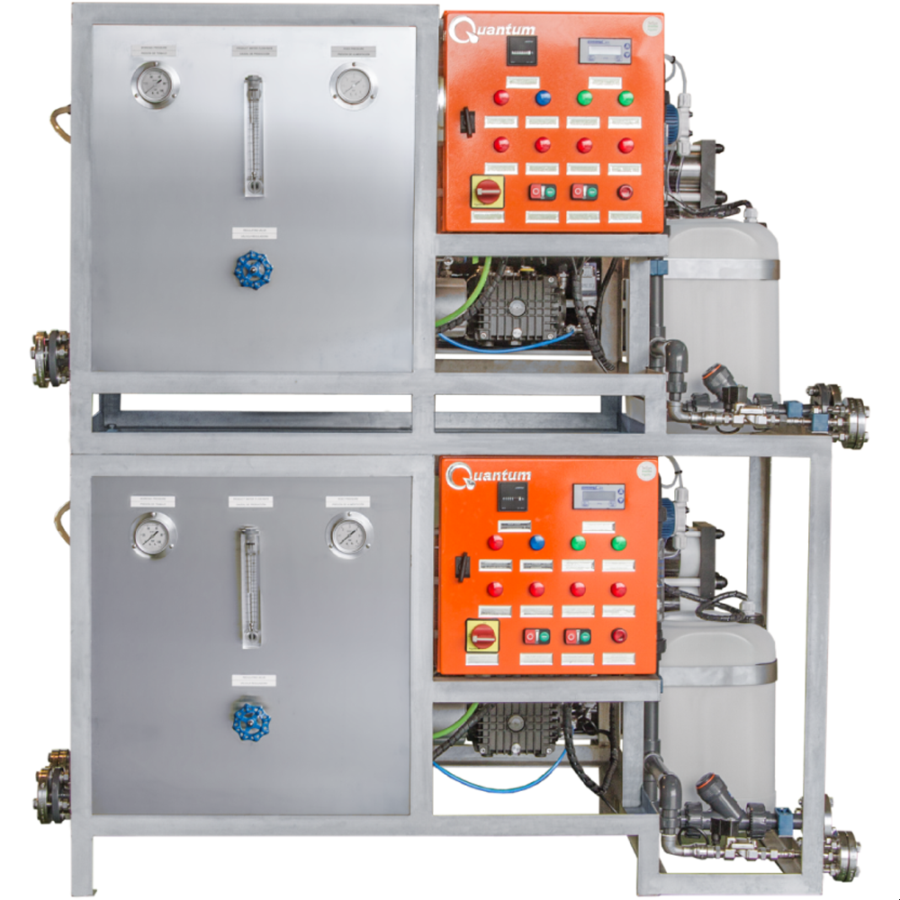 Industrial equipment with two red control panels labeled 'Quantum,' gauges, pipes, and valves.