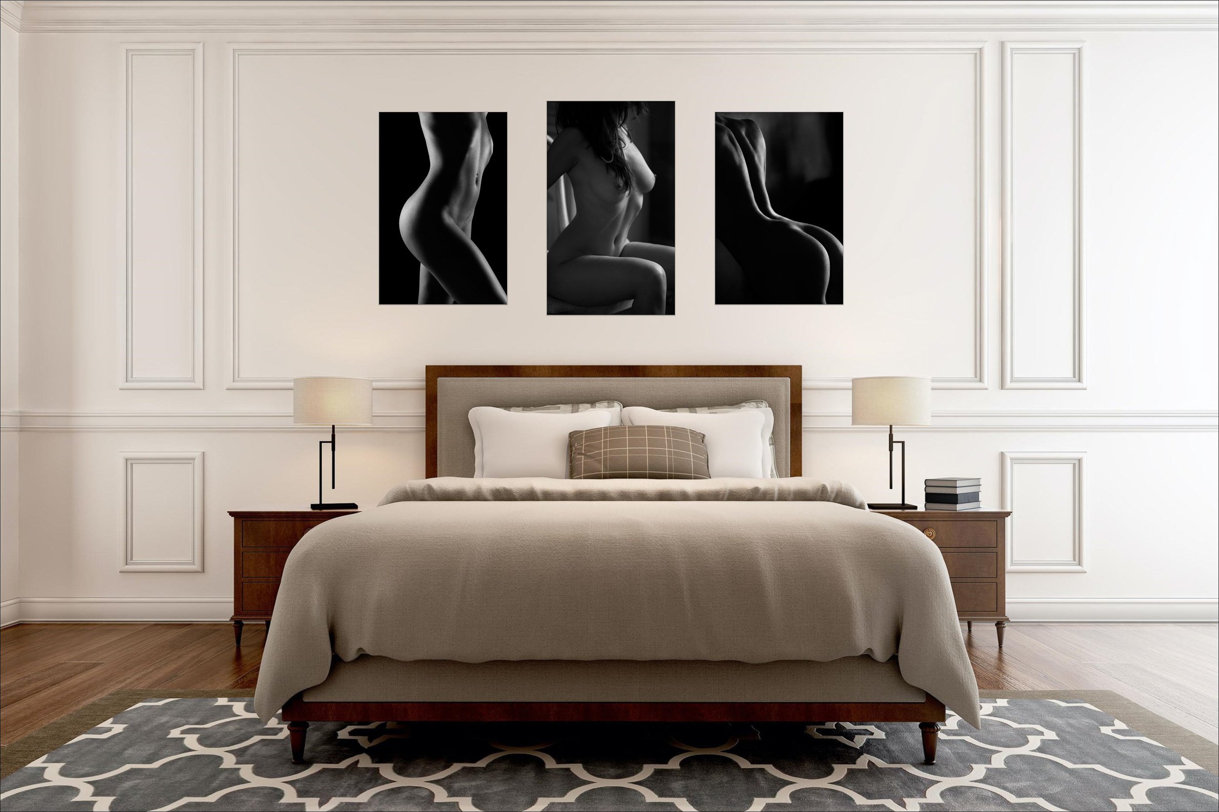 Bedroom interior with framed fine art portrait photography displayed above the bed.

