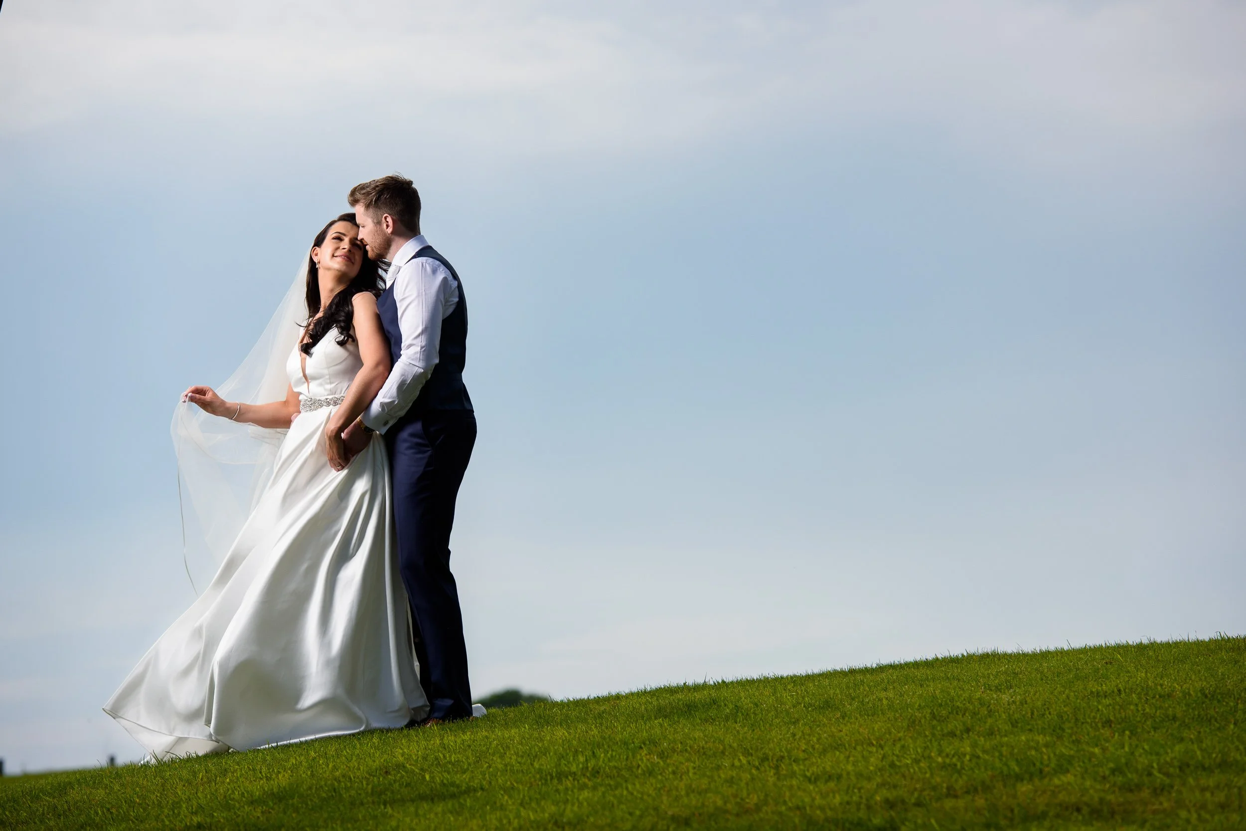 Wedding Photography Dublin – couple portrait outdoors under cloudy sky at The Sheraton Hotel