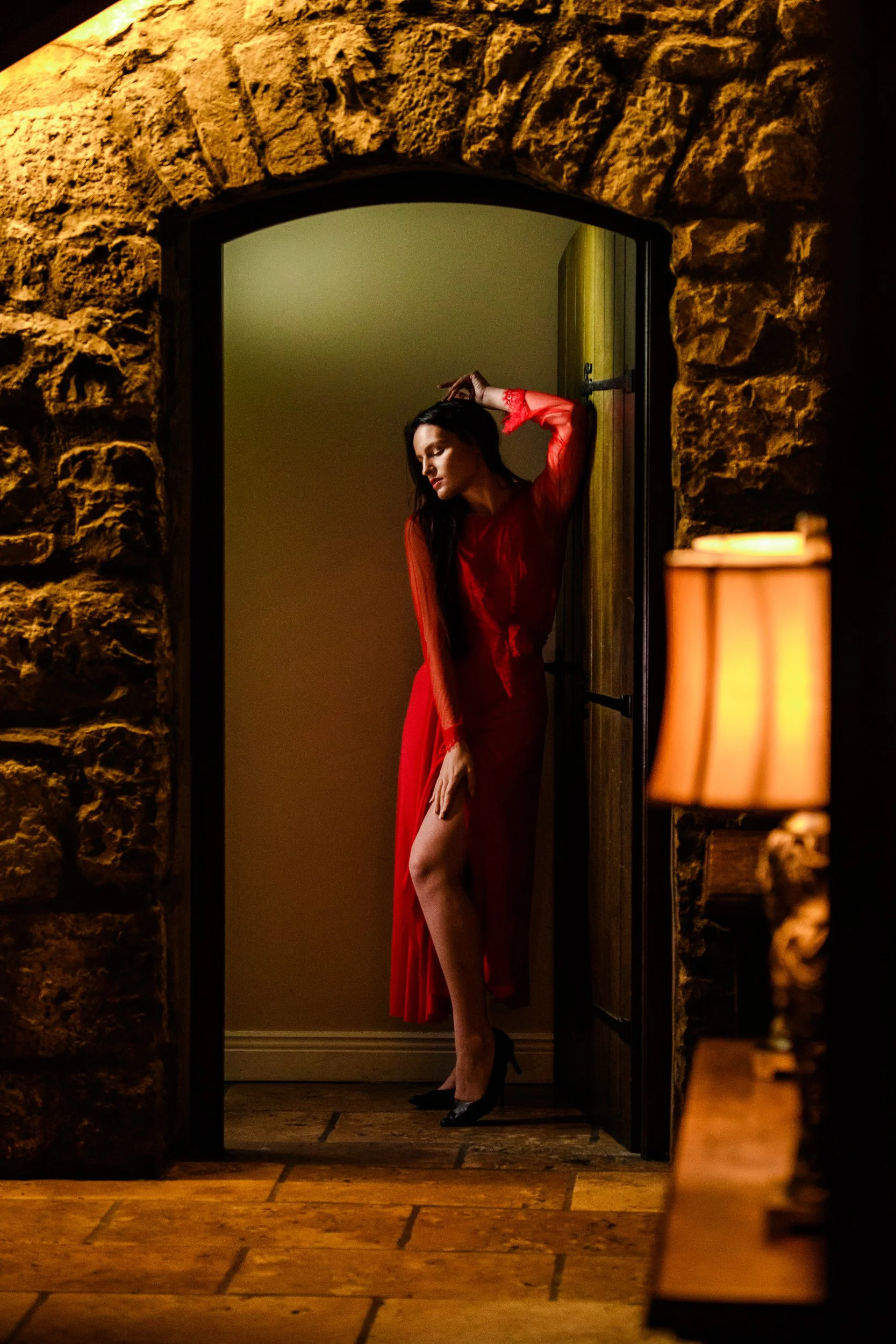 Editorial Portrait Photography Galway – red dress portrait in stone doorway at Cloghan Castle