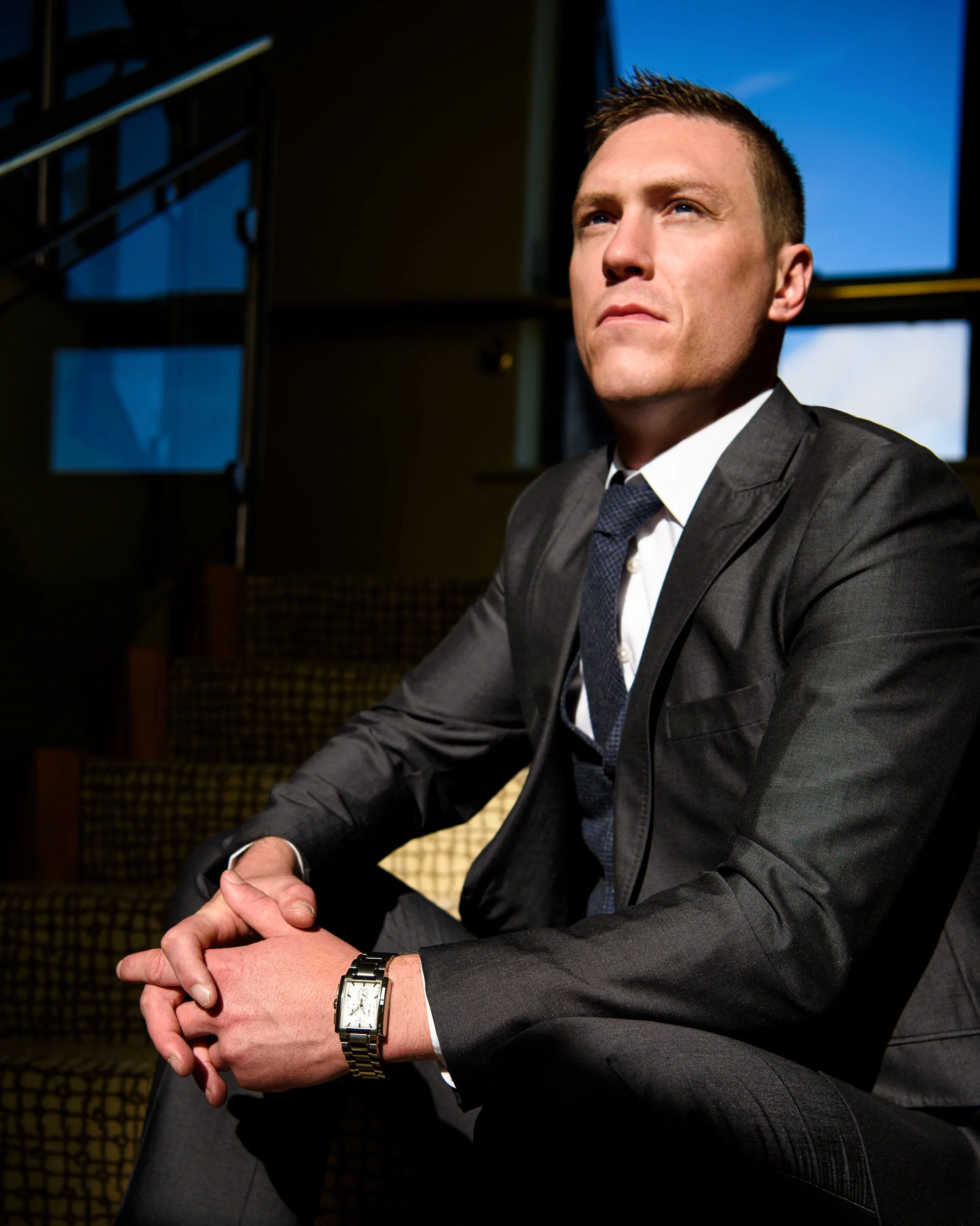 Wedding Photography Westmeath – groom portrait on staircase with natural light at Glasson Lakehouse