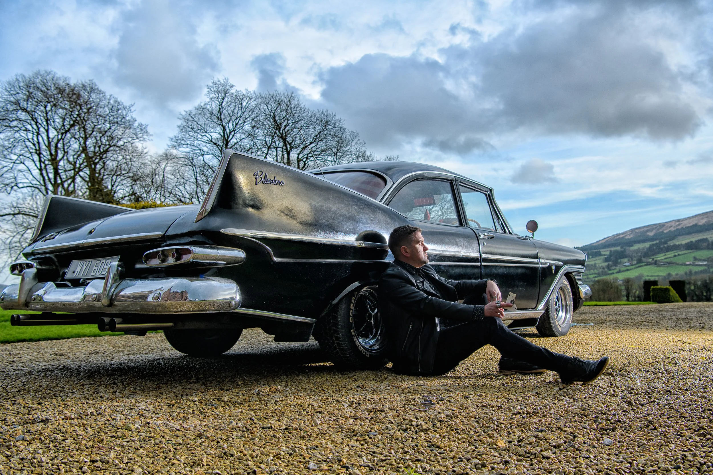 Portrait Photography Limerick – portrait with classic car in outdoor setting at Castle Oliver