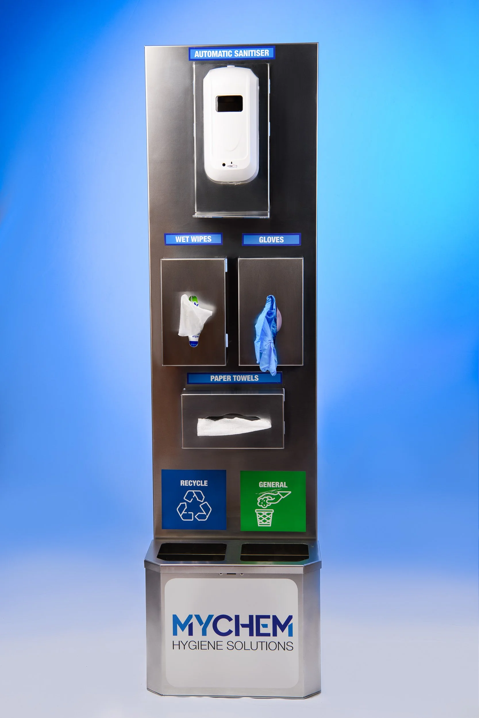 A hygiene solution station with compartments for an automatic sanitizer, wet wipes, gloves, and paper towels, with recyclables and general waste bins at the bottom, branded 'MYCHEM.'